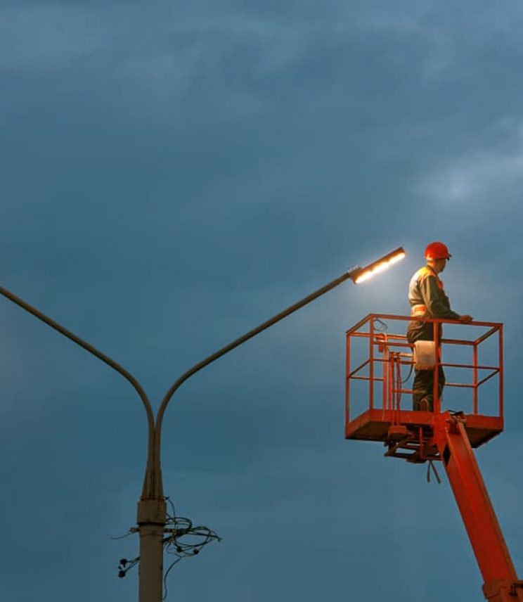 Man working on light post — Electrical & Air-Conditioning in Melbourne, VIC