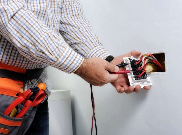 Testing electrical plug — Electrical & Air-Conditioning in Springwood, QLD